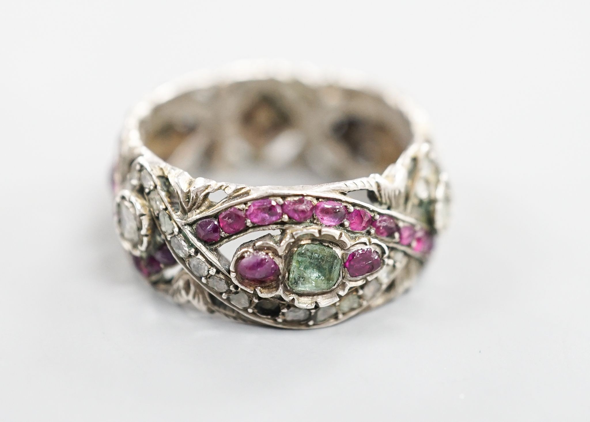 A 19th century Austro-Hungarian pierced white metal, diamond and gem set band, size W/X.